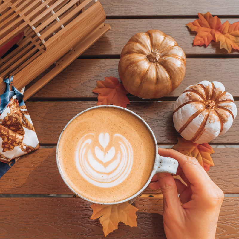 fall coffee with pumpkins and leaves image