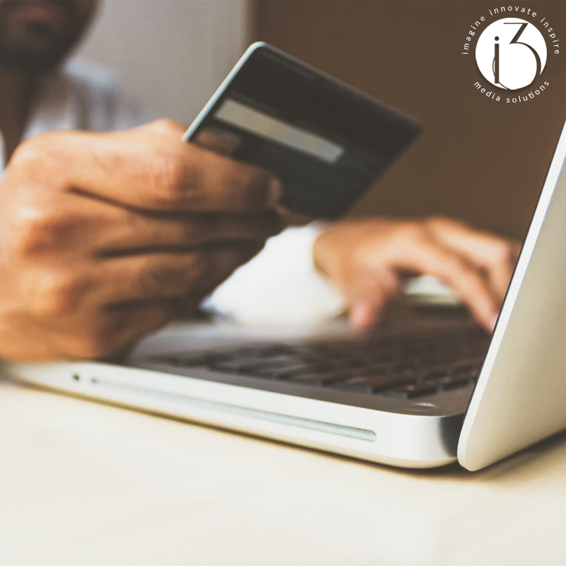online shopping with a credit card and laptop image
