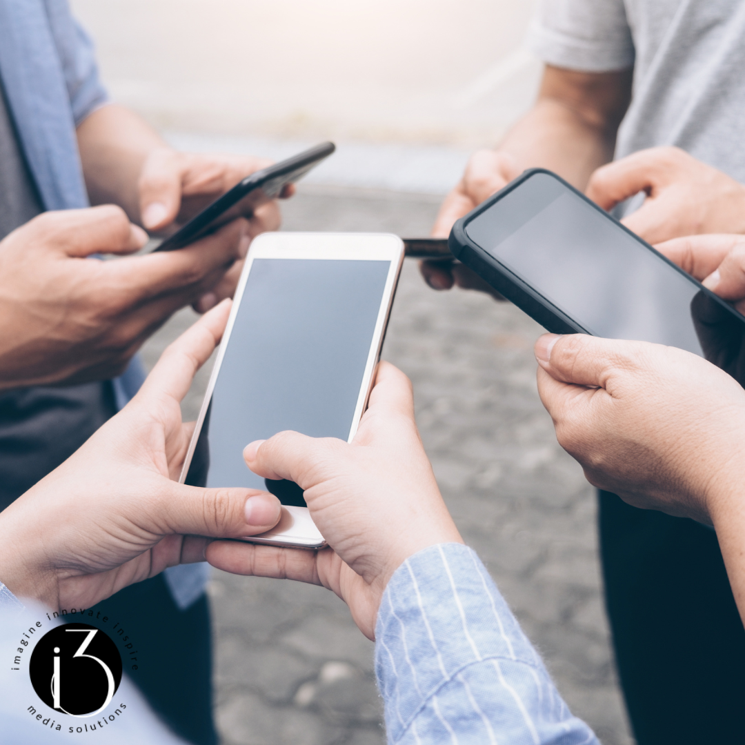 group of people using their phones image